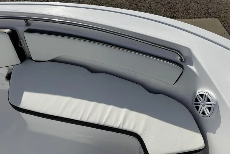 Slide: The Image of 2026 Tidewater 198 CC Adventure boat interior with cushioned seating and speaker. - 8