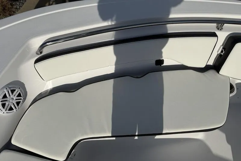 Slide: The Image of 2026 Tidewater 198 CC Adventure boat interior with cushioned seating and speaker. - 9