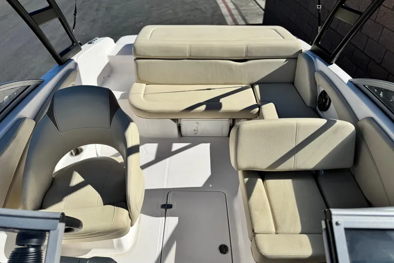 Slide: The Image of 2020 Regal 1900 ES Bowrider interior with beige seating and modern design. - 14