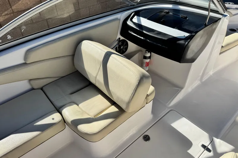 Slide: The Image of 2020 Regal 1900 ES Bowrider interior with beige seating and dashboard. - 20