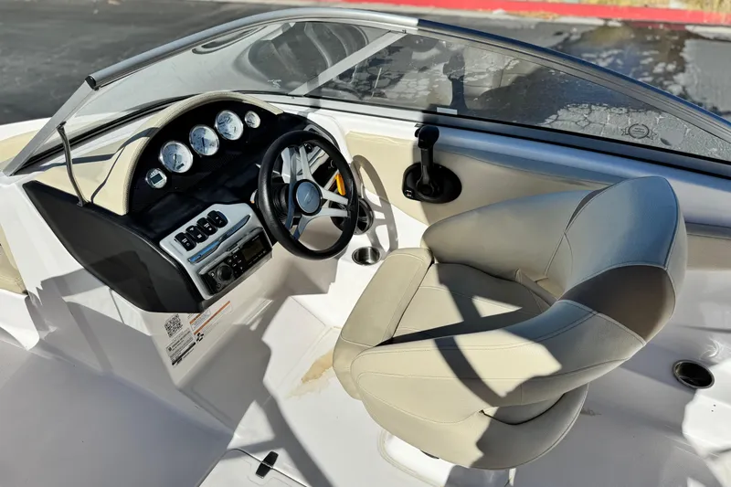 Slide: The Image of 2020 Regal 1900 ES Bowrider dashboard and captain's seat, featuring modern controls. - 22
