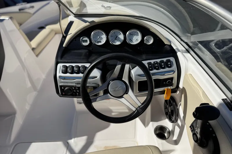 Slide: The Image of 2020 Regal 1900 ES Bowrider dashboard with steering wheel and control panel. - 23