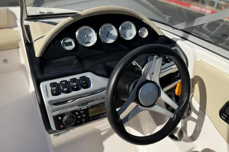 Slide: The Image of Dashboard of 2020 Regal 1900 ES Bowrider with steering wheel and control panel. - 24