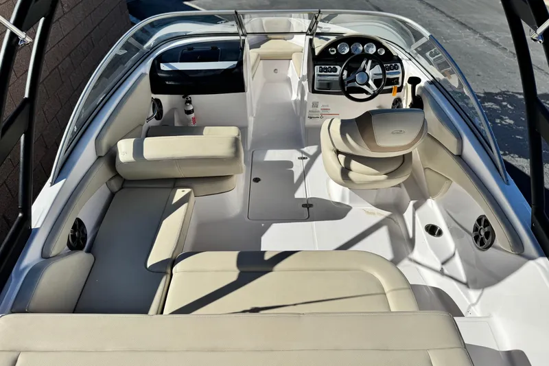 Slide: The Image of 2020 Regal 1900 ES Bowrider interior with beige seating and modern dashboard. - 9