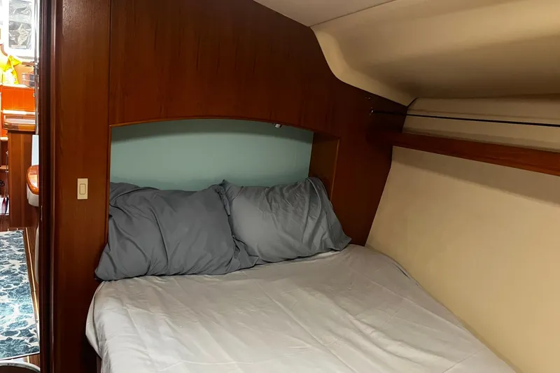 Slide: The Image of Cozy cabin interior of 2006 Hunter 41 Deck Salon sailboat with comfortable bedding. - 22