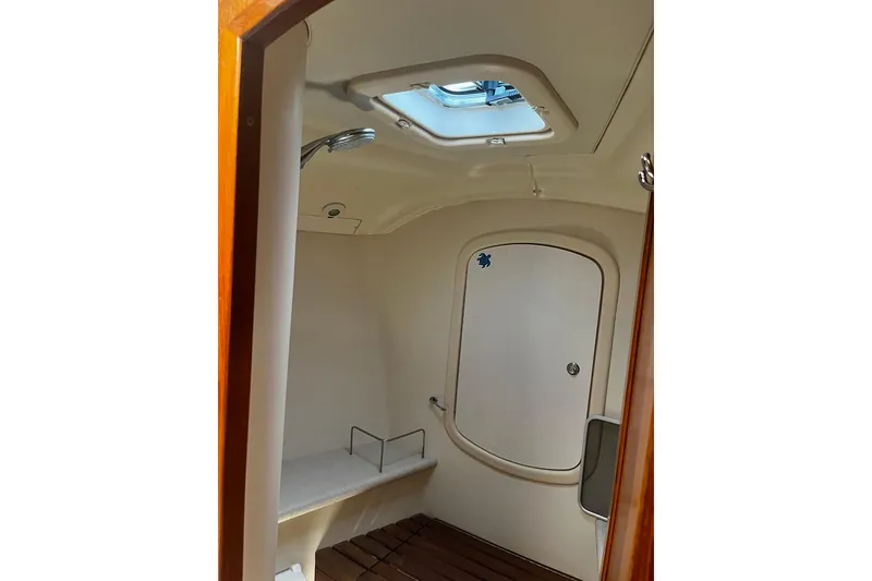 Slide: The Image of Interior of 2006 Hunter 41 Deck Salon yacht bathroom with skylight and wooden flooring. - 28