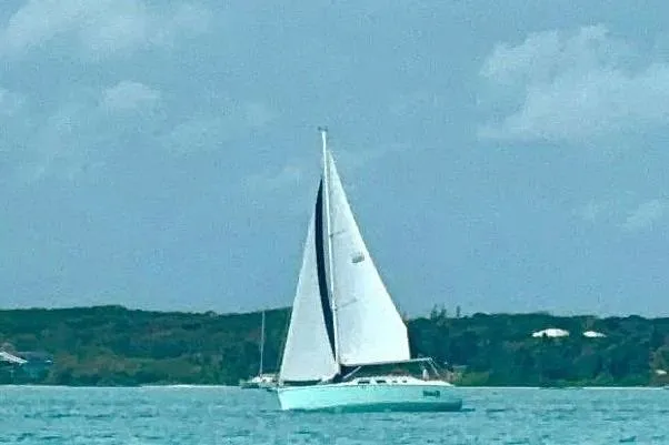 Slide: The Image of Sailboat on turquoise water, 2006 Hunter 41 Deck Salon, under clear skies. - 4