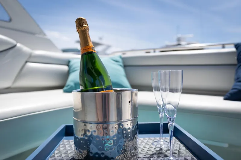 Slide: The Image of Champagne and glasses on Avanti 4085 Sunbridge yacht, 1998 model, with luxurious seating. - 12