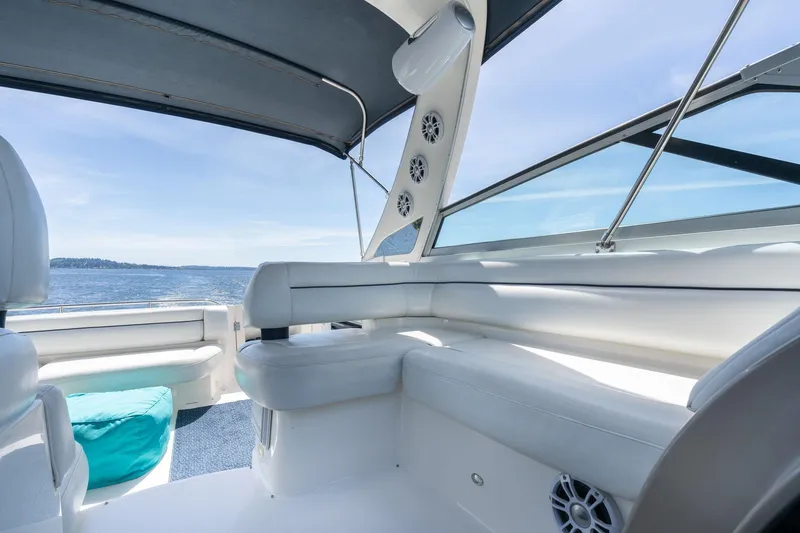 Slide: The Image of 1998 Avanti 4085 Sunbridge boat interior with white seating and ocean view. - 13