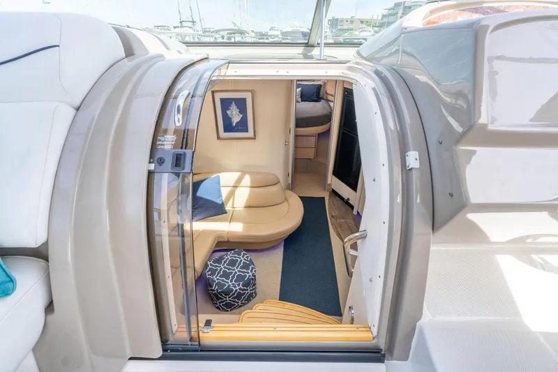 Slide: The Image of Interior view of 1998 Avanti 4085 Sunbridge yacht, featuring cozy seating and elegant decor. - 17