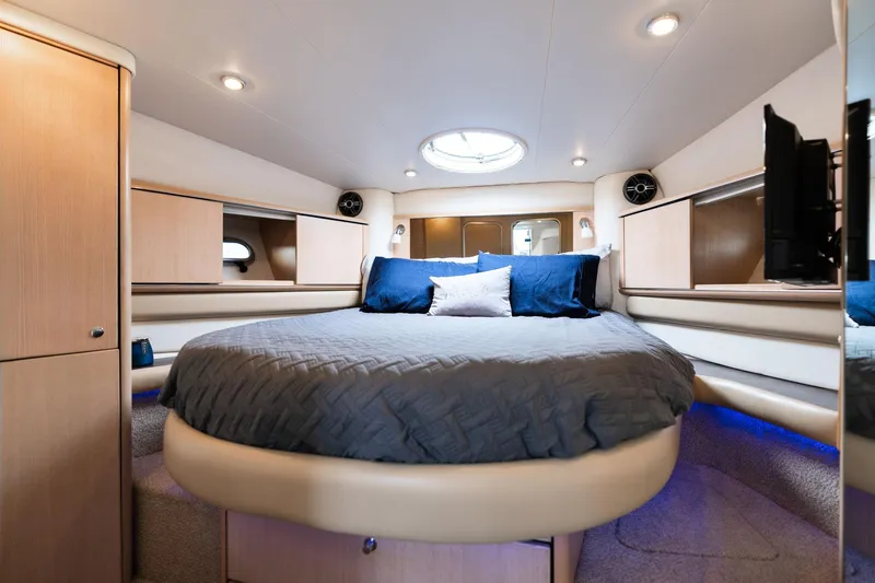 Slide: The Image of Luxurious cabin interior of 1998 Avanti 4085 Sunbridge yacht with cozy bed and modern lighting. - 24