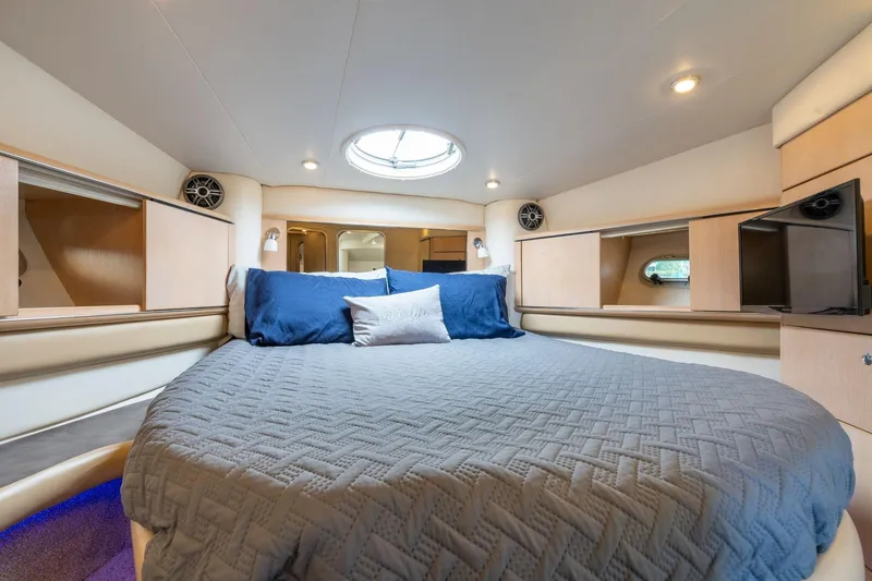 Slide: The Image of Luxurious 1998 Avanti 4085 Sunbridge yacht bedroom with cozy bedding and modern amenities. - 25