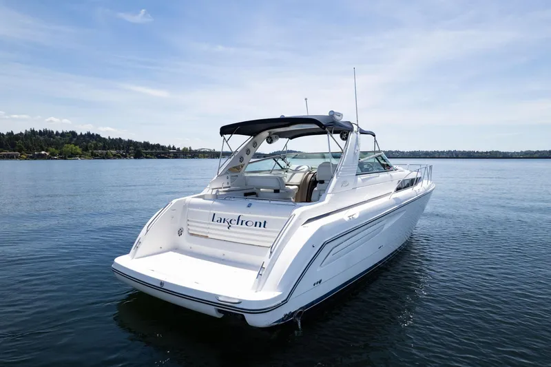 Slide: The Image of 1998 Avanti 4085 Sunbridge yacht on serene lake waters. - 3