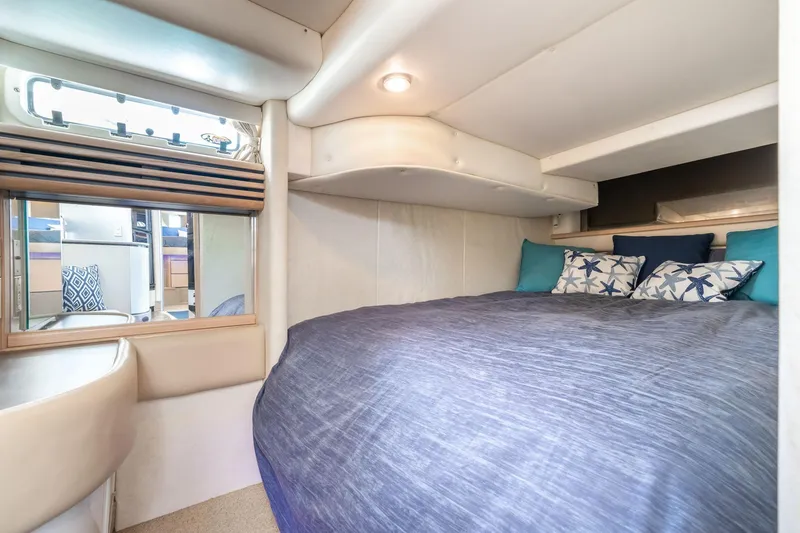 Slide: The Image of Cozy bedroom in 1998 Avanti 4085 Sunbridge yacht with nautical-themed pillows. - 30