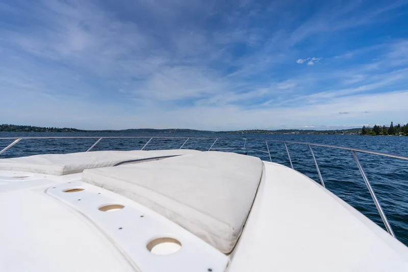 Slide: The Image of 1998 Avanti 4085 Sunbridge yacht on open water under clear blue sky. - 39