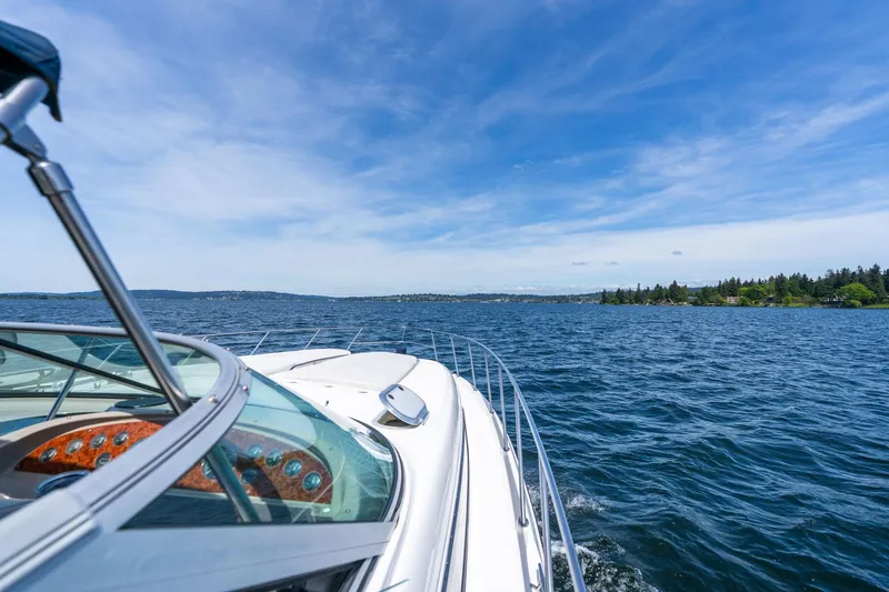 Slide: The Image of 1998 Avanti 4085 Sunbridge cruising on a clear blue lake under a sunny sky. - 42