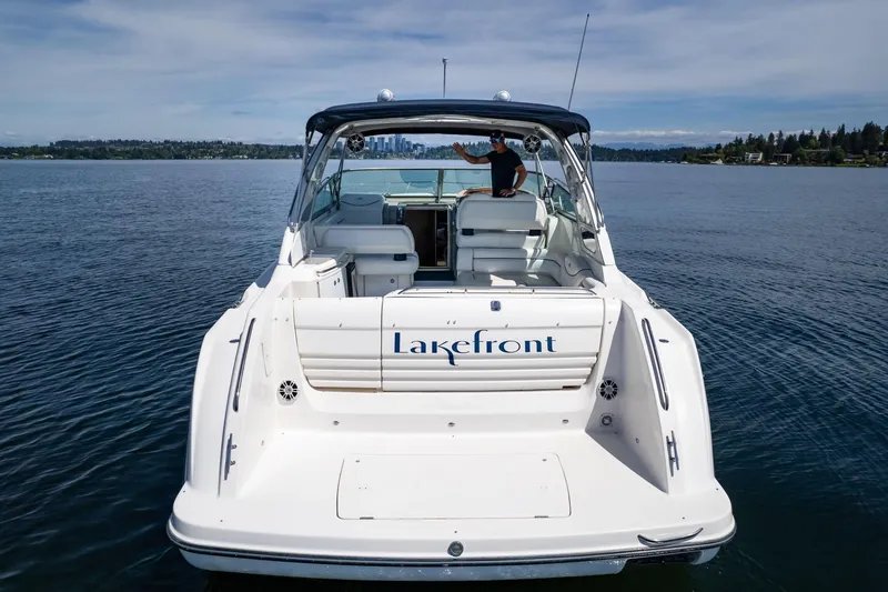 Slide: The Image of 1998 Avanti 4085 Sunbridge boat named "Lakefront" on a serene lake. - 45