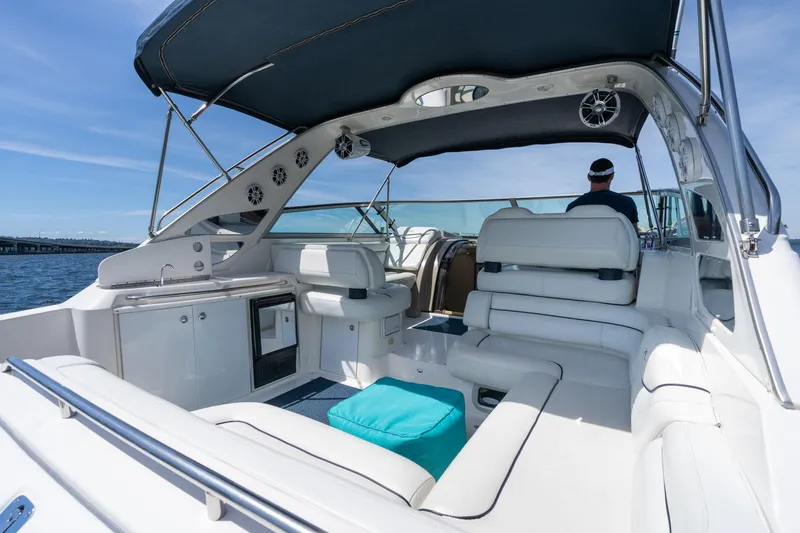 Slide: The Image of 1998 Avanti 4085 Sunbridge yacht interior with white seating and blue skies. - 6