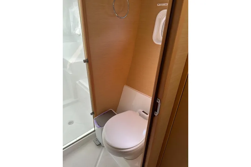 Slide: The Image of Compact bathroom in 2015 Lagoon 380 S2 yacht with modern fixtures. - 17