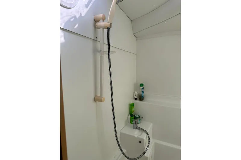 Slide: The Image of Shower area in 2015 Lagoon 380 S2 yacht bathroom with toiletries. - 19