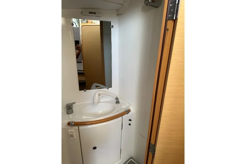 Slide: The Image of Bathroom interior of 2015 Lagoon 380 S2 yacht with sink and mirror. - 23