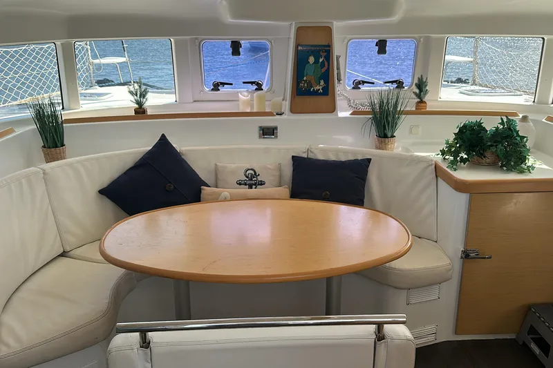 Slide: The Image of Interior of 2015 Lagoon 380 S2 catamaran with cozy seating and nautical decor. - 3