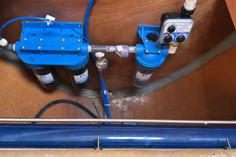 Slide: The Image of Water filtration system in a 2015 Lagoon 380 S2 boat interior. - 40