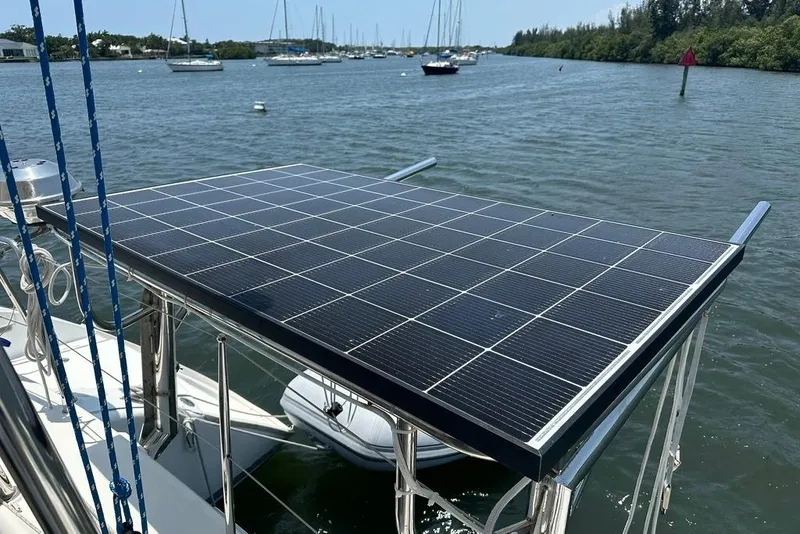 Slide: The Image of Solar panel on 2015 Lagoon 380 S2 catamaran, docked in a serene marina. - 42