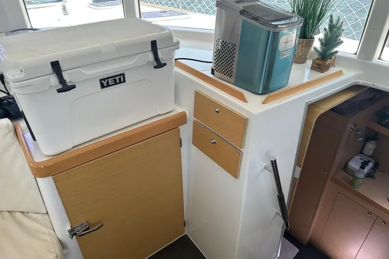 Slide: The Image of Interior of 2015 Lagoon 380 S2 with Yeti cooler and ice maker. - 7