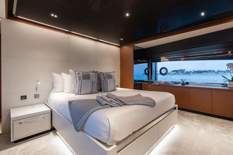 Slide: The Image of Luxurious bedroom interior on 2020 Riva 90 Argo yacht with ocean view. - 23