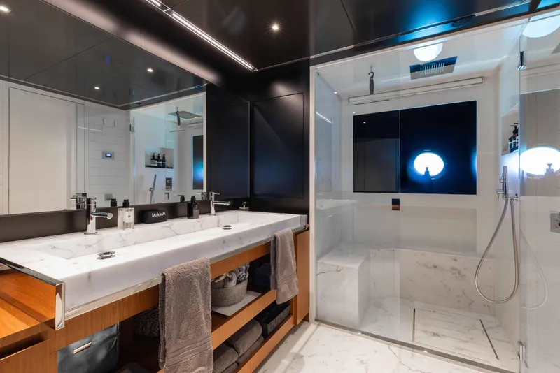 Slide: The Image of Luxurious bathroom on 2020 Riva 90 Argo yacht with marble sink and modern shower. - 29