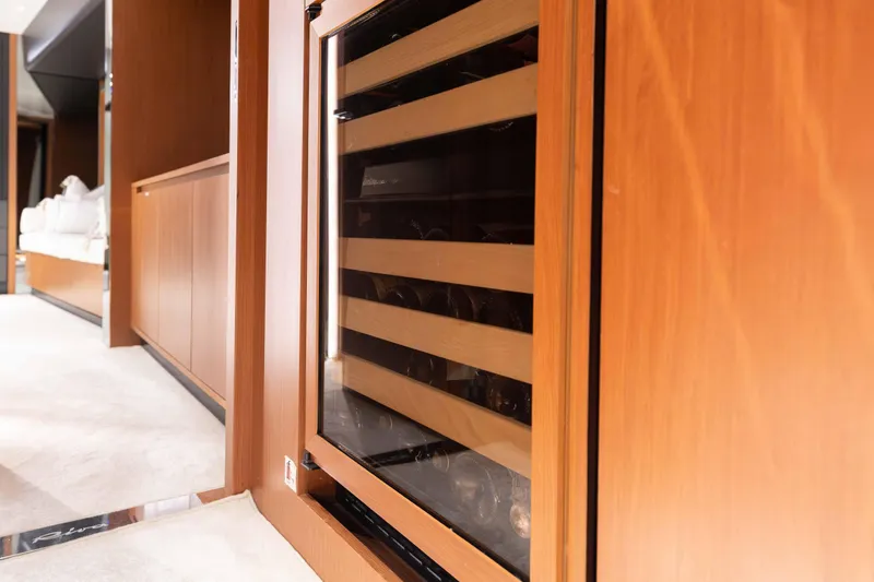 Slide: The Image of Luxurious interior of 2020 Riva 90 Argo yacht with elegant wood paneling. - 31