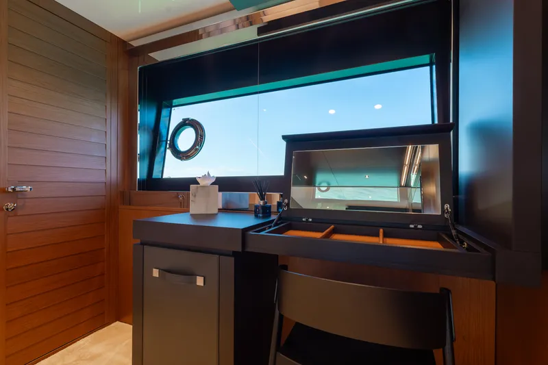 Slide: The Image of Luxurious interior of 2020 Riva 90 Argo yacht with elegant wooden finishes. - 35