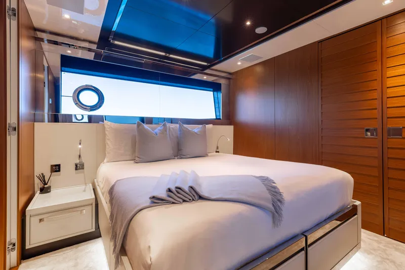 Slide: The Image of Luxurious bedroom interior on 2020 Riva 90 Argo yacht with modern design and elegant furnishings. - 40