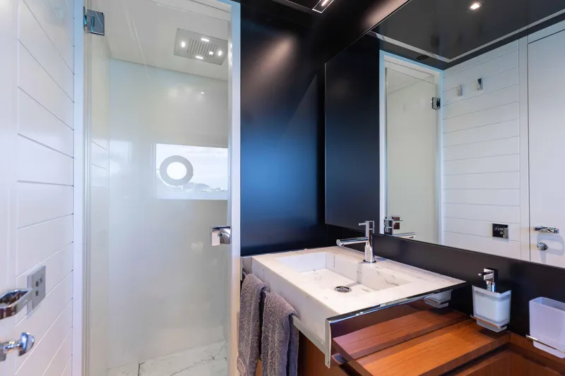 Slide: The Image of Luxurious bathroom interior on 2020 Riva 90 Argo yacht, featuring modern sink and shower. - 41