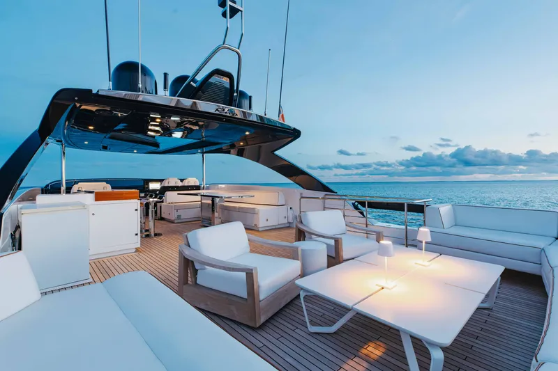 Slide: The Image of Luxurious 2020 Riva 90 Argo yacht deck with elegant seating and ocean view. - 49