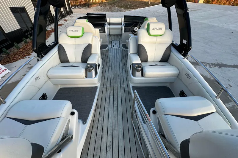 Slide: The Image of 2017 Manitou Xplode 250 pontoon boat interior with luxurious seating and modern design. - 18