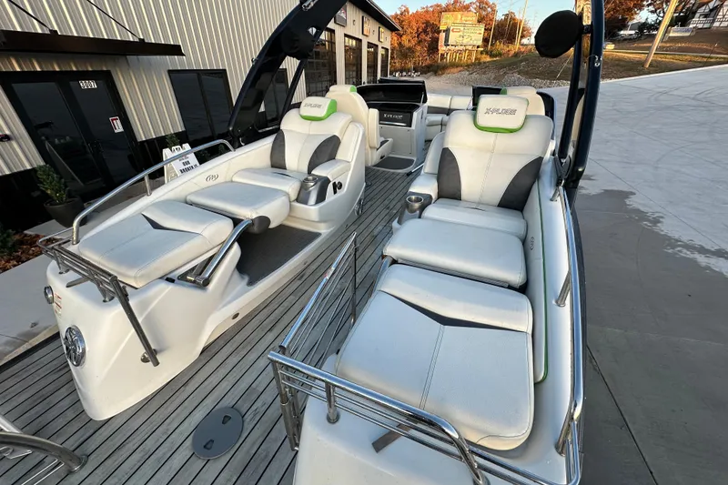 Slide: The Image of 2017 Manitou Xplode 250 pontoon boat with luxurious seating and modern design. - 19