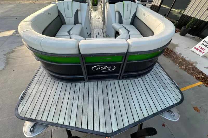 Slide: The Image of 2017 Manitou Xplode 250 pontoon boat with stylish seating and sleek design. - 25