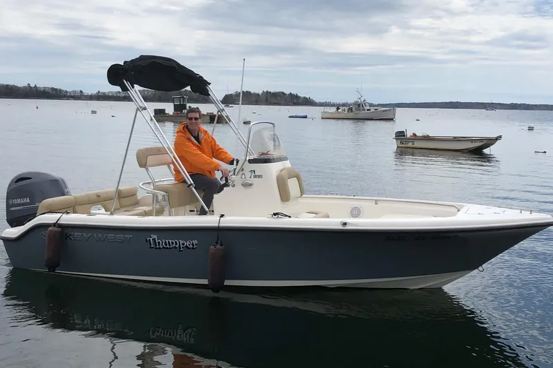 Slide: The Image of 2018 Key West 189 FS boat on calm water with a person onboard. - 5