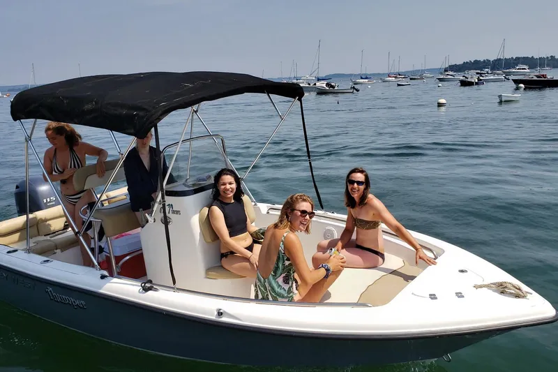 Slide: The Image of Group enjoying a day on a 2018 Key West 189 FS boat, surrounded by water and other boats. - 8