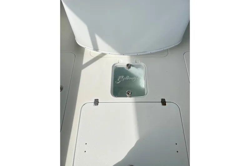 Slide: The Image of 2018 Yellowfin 36 Offshore boat with cushioned seating and sleek design. - 9