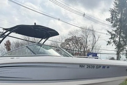 Slide: The Image of 2023 Chaparral 23 SSi boat with canopy, parked outdoors, registration NH 2639 GP. - 4