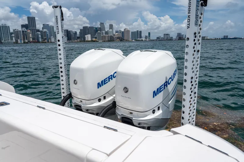Slide: The Image of Twin Mercury outboard engines on 2021 Intrepid 345 Nomad FE, city skyline in background. - 18