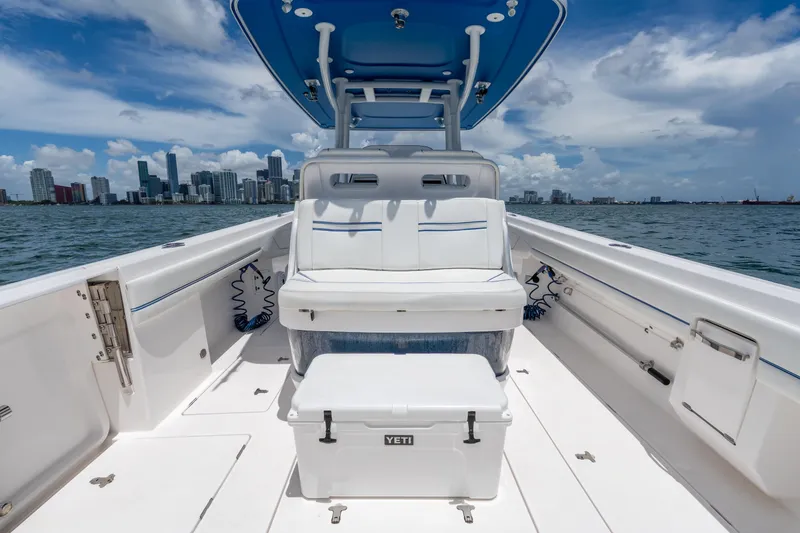 Slide: The Image of 2021 Intrepid 345 Nomad FE boat interior with city skyline in background. - 22