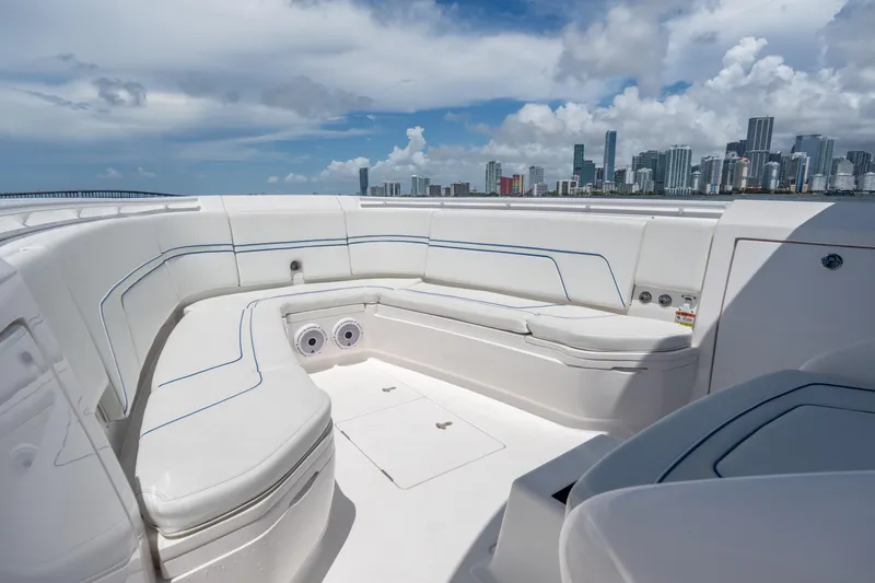 Slide: The Image of 2021 Intrepid 345 Nomad FE boat interior with city skyline in background. - 46