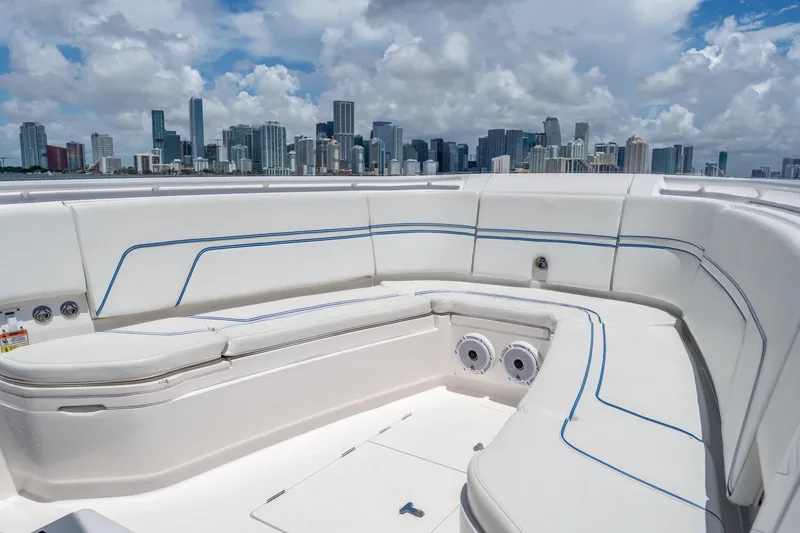 Slide: The Image of 2021 Intrepid 345 Nomad FE boat interior with city skyline in background. - 48