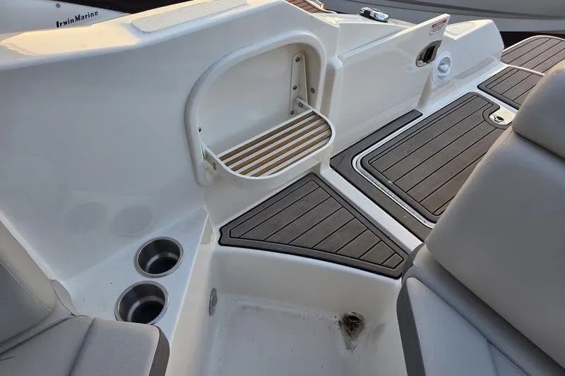 Slide: The Image of 2024 Sea Ray 270 Sundeck boat on dry dock, blue hull, autumn background. - 1