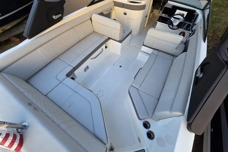 Slide: The Image of 2024 Sea Ray 270 Sundeck interior with spacious seating and modern design. - 10
