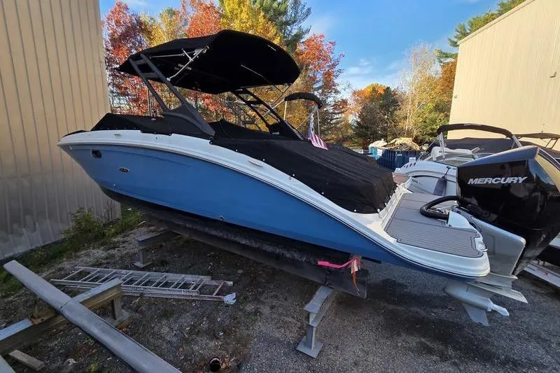 Slide: The Image of 2024 Sea Ray 270 Sundeck interior with cup holders and non-slip flooring. - 2